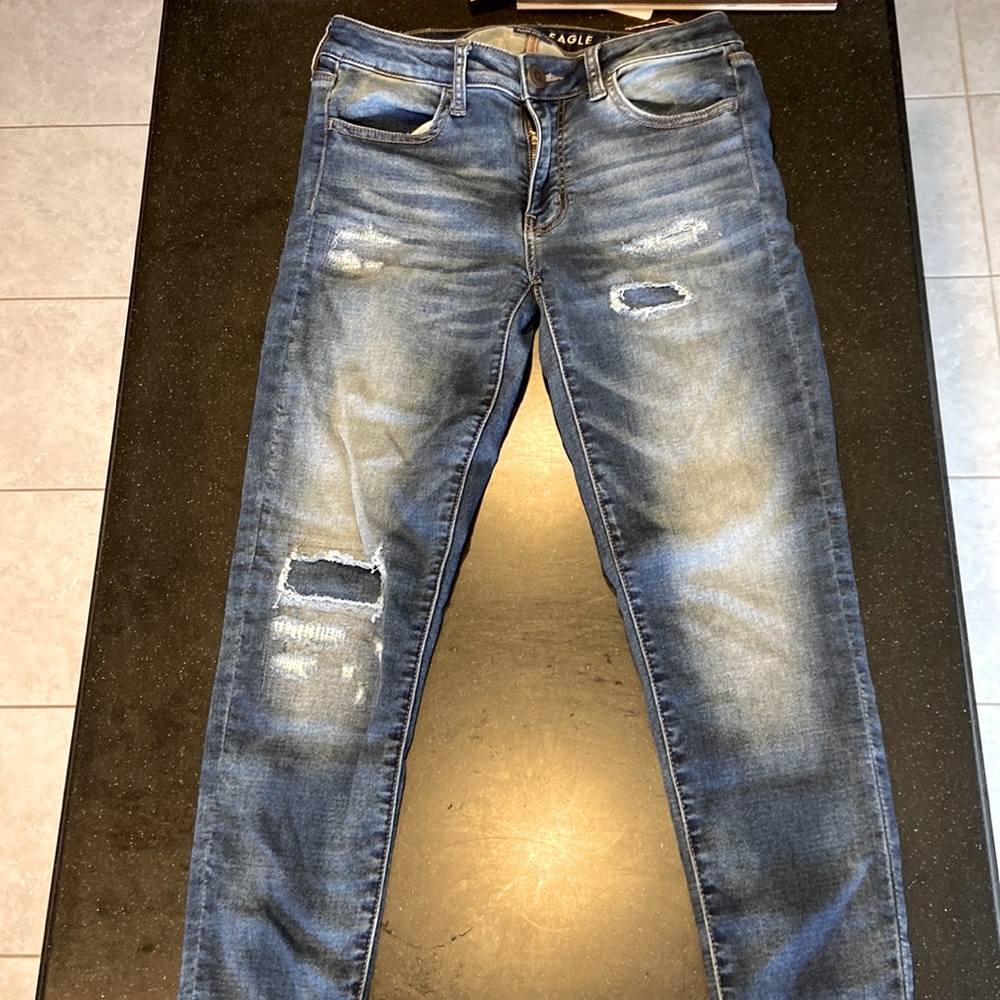 American Eagle jeggings. Size 6 regular dark denim. Factory ripped